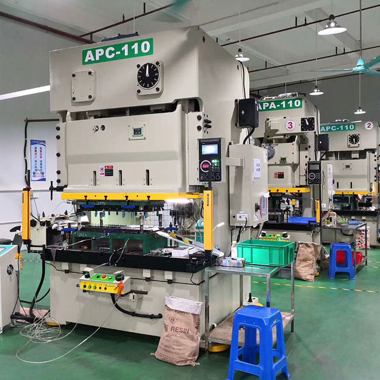 In which industries are flywheel press machines widely used?